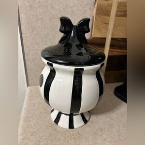 Black and white bow striped canister
